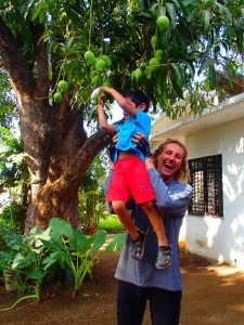Bryan with Rodrigo's son picking mangos
